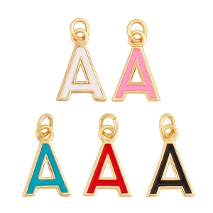 Detailed view of colorful enamel letter A pendants in gold-plated metal for jewelry making