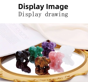Macro detail of various gemstone elephant carvings on a vintage golden mirror tray