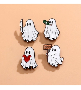 Detailed view of four cute Halloween ghost enamel pins on a vibrant orange background