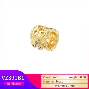 Hollow 18K gold brass cylinder charm with textured grain and rhinestone accents