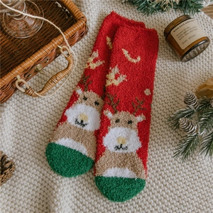 Plush Christmas coral fleece socks with reindeer pattern in festive red and green