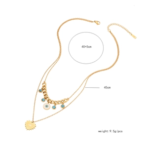 Double-layered gold necklace featuring evil eye and heart charms with weight parameters