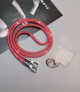 Close-up of red rhinestone phone lanyard with silver lobster clasps and clear patch
