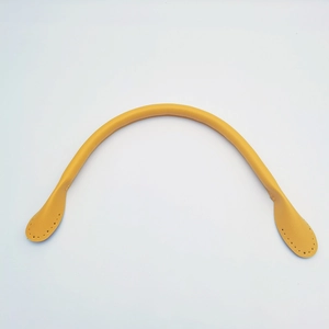 Detail of yellow leather handbag handle with pre-punched stitching holes for DIY repair