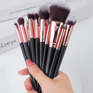 Close-up of makeup brush set with rose gold ferrules and soft gradient synthetic bristles