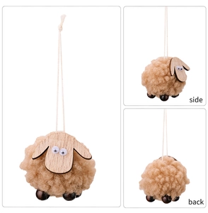 Three-way view of a handmade brown felt sheep ornament with wooden head and bead legs