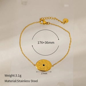 Detail view of gold-plated stainless steel bracelet with dimensions and black stone pendant