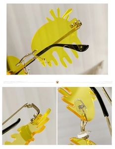 Detail of yellow fluid tear-shaped lenses with gold metal hinges and nose pads