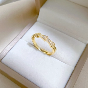 Bamboo-style gold ring with zircon accents in a premium velvet jewelry box