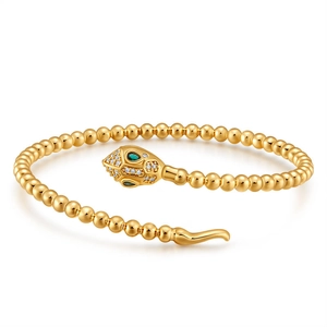 Elegant 18K gold plated snake-shaped beaded bracelet with green eyes and crystal accents