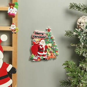 Detail of 3D resin Christmas fridge magnets with Santa Claus and festive tree design