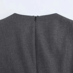 Detail of dark grey midi dress showing a high-quality hidden zipper and fine fabric texture