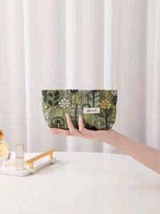 Floral embroidery canvas makeup bag in dark green featuring large capacity with zipper