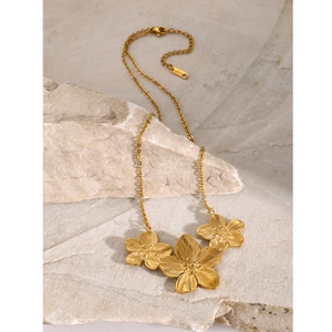 18k gold-plated stainless steel necklace with three textured flower pendants on stone base