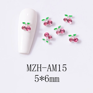 Detailed 5x6mm pink cherry nail charms with green leaves shown on white nail tips