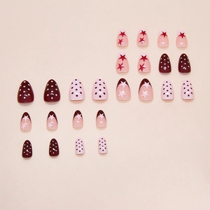 Pink and red press on nails with French tips, stars and chic polka dot patterns