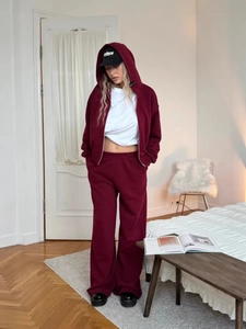 Women's burgundy tracksuit with zip-up hoodie and wide-leg jogger pants set