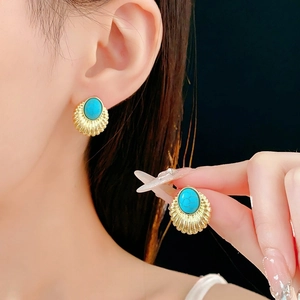 Vintage gold geometric stud earrings with turquoise stones in a fan-shaped design