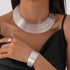Silver geometric metallic collar necklace set with wide cuff and ring on female model