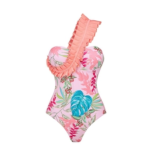 Detail of ruffle shoulder design and floral tropical print on one-piece swimsuit