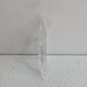 Close-up of the slim side profile and material thickness of this transparent acrylic ornament