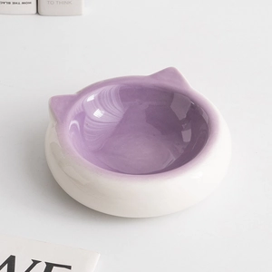 Minimalist purple cat-shaped ceramic bowl for cats and dogs on a clean white background