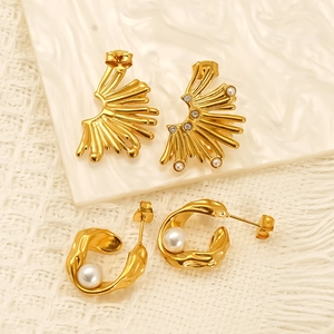 Golden irregular C-shape hoop earrings with white pearls and fan-shaped stud earrings