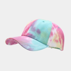 Detail of multi-color tie-dye baseball cap fabric and reinforced curved brim stitching