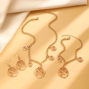 Golden alloy jewelry set with hollow rose flower pendants and spiral necklace bracelet earrings