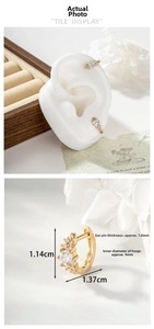 Detailed view showing dimensions and the fit of light gold cubic zirconia hoop earrings