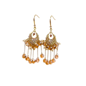 Bohemian gold tassel earrings with colorful crystals and pearls on white background
