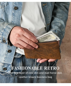 Detail showing vintage crazy horse leather texture and metal zipper of the long wallet