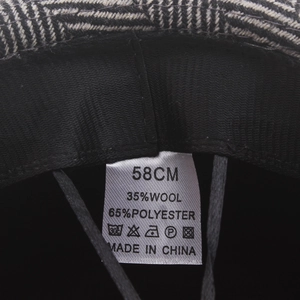 Herringbone wool jazz hat interior view showing 58cm size label and 35% wool material