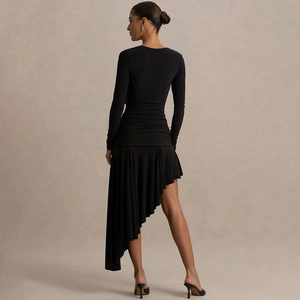 Back view of black long sleeve dress with ruched waist and asymmetrical hemline details