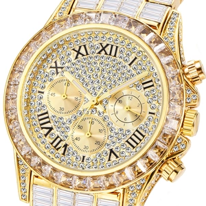 Detail of gold chronograph watch dial featuring Roman numerals and full crystal inlay