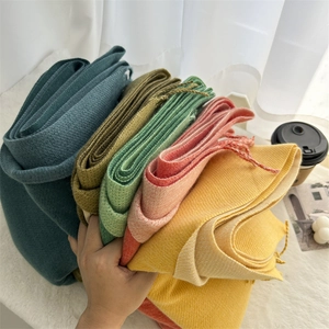 Double-sided cashmere-like scarf with tassels in vibrant colors for winter warmth
