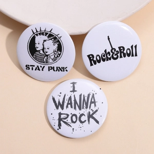 Three punk rock tinplate badges with Stay Punk and Rock n Roll slogans on white background