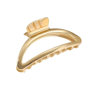 Minimalist large gold metal shark hair claw clip with a polished hollow half-moon design