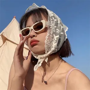 White lace triangle bandana with floral embroidery and head tie for chic outdoor styling