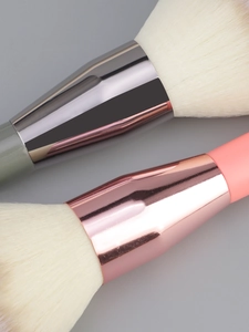 Detail shot of soft synthetic bristles and metallic ferrule on a large powder makeup brush