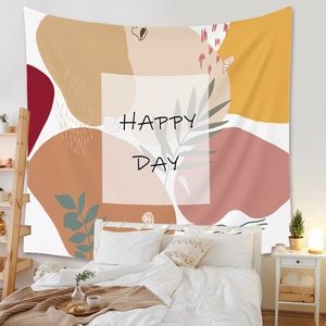 Detail of Bohemian tapestry with Happy Day print and abstract leaf patterns for wall decor