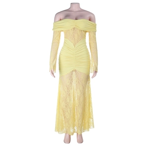 Detail of off-shoulder light yellow lace dress with pleated fabric and sheer long sleeves