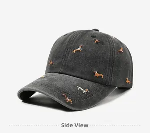 Detail of vintage washed cotton baseball cap with dachshund dog embroidery pattern