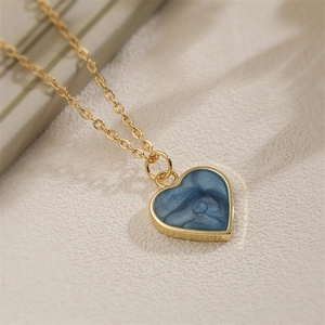 Fashionable gold link chain necklace with a blue marble texture heart pendant for women