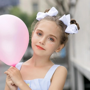 15-piece set of white ribbed bow hair clips for girls styled on double buns