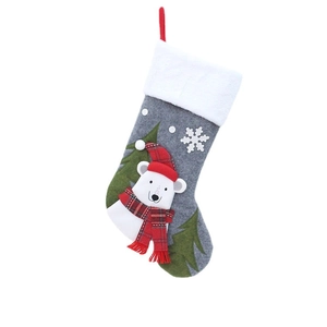 Grey Christmas stocking with polar bear, plush white cuff, and red hanging loop for decor