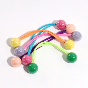 Close-up of candy-colored elastic hair ties with round beads in a colorful 7-piece set