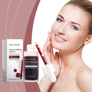 Macro view of AHA and BHA facial peeling serum showing the red liquid texture and dropper