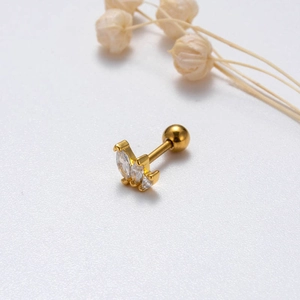 Macro view of gold stud earring with marquise-cut zircons and ball screw back closure