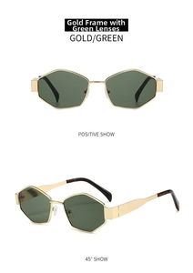 Detail view of gold geometric sunglasses with dark green lenses and tortoiseshell tips